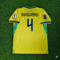 Maillot de football domicile jaune Marquinhos #4 Brésil Coupe du monde 2026